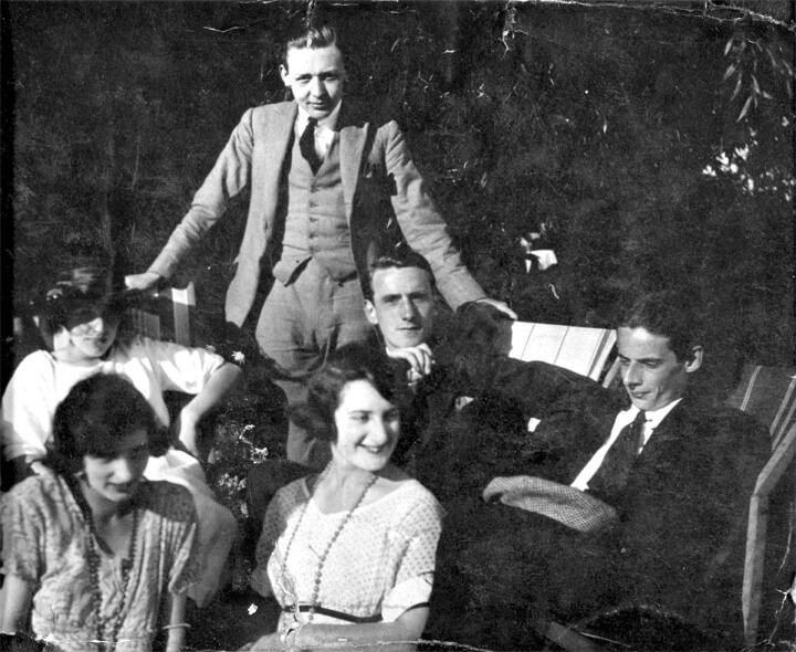 Photograph of Edward (standing), together with colleagues, at a Stoll Theatres office party in 1921.