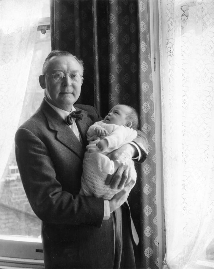 Edward holding his son Robert in 1959.